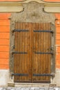 Wooden doors with metal hinges and forged elements Royalty Free Stock Photo