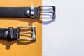 Two leather men`s belts on colored background Royalty Free Stock Photo