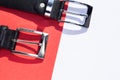 Two leather men`s belts on colored background Royalty Free Stock Photo