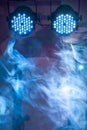 Two led blue concert and nightclub lights with smoke