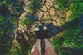 Two legs in black sneakers stand on cracked ground Royalty Free Stock Photo