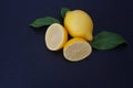 Two lemons on a black slate background Royalty Free Stock Photo