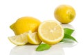 Two lemons and half with leaves Royalty Free Stock Photo