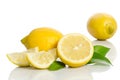 Two lemons and half with leaves Royalty Free Stock Photo