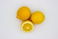 Two lemons and a half of a lemon isolated image on a white background Royalty Free Stock Photo