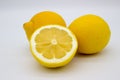 Two lemons and a half of a lemon isolated image on a white background