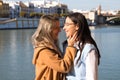 Two lesbian women are in a park next to a river. The women are young and newlyweds celebrating their honeymoon. Concept lgtb, gays