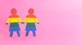 Two lgbt flag women icons on pink background. Lesbian and bisexual girls concept, copy space for text