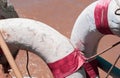 Two life buoy rings strapped on the side of ferryboat transporting cross the river in thailand Royalty Free Stock Photo