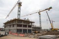 Two lifting crane and building under construction Royalty Free Stock Photo