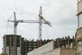 Lifting tower cranes on frame of frame building Royalty Free Stock Photo