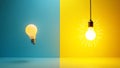 Two lightbulbs on a blue and yellow background Royalty Free Stock Photo