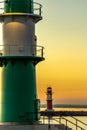 Two lighthouses at beautiful sunset one green and the other red Royalty Free Stock Photo