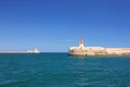 Two lighthouses on calm deep blue sea in Grand Harbor in Valletta, Malta Royalty Free Stock Photo