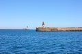 Two lighthouses on calm sea in Grand Harbor in Valletta, Malta Royalty Free Stock Photo