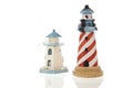 Two lighthouses in closeup and isolated in white Royalty Free Stock Photo
