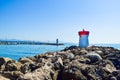 Two lighthouses located on the rocks of the breakwaters that protect the entrance to the marina