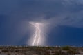 Two lightning bolts strike from a thunderstorm in Arizona Royalty Free Stock Photo