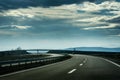 Two line wide highway on a cloudy winter day