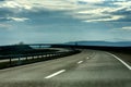 Two line wide highway on a cloudy winter day