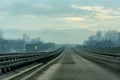 Two line wide highway on a cloudy winter day