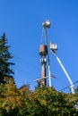 Two linemen up in the air installing 5G, new technology, wireless communications on a wood