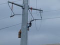 Linemen Work On High Voltage Lines Royalty Free Stock Photo