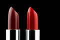 Two Lipsticks Upright on a Black Background Royalty Free Stock Photo