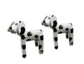 Two of litle wooden dogs white mixed black colored standind isolated on white background