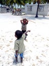 Two little African boys playing on Jambiani beach, Zanzibar