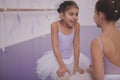 Two little ballerinas talking after dancing lesson Royalty Free Stock Photo