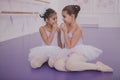 Two little ballerinas talking after dancing lesson Royalty Free Stock Photo