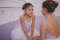 Two little ballerinas talking after dancing lesson Royalty Free Stock Photo