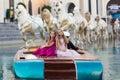 Two little beautiful girls in lush fashionable dresses sit on a boat on vacation. Girls posing Royalty Free Stock Photo