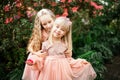 Two little beautiful sisters are walking and having fun in azaleas park Royalty Free Stock Photo