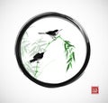 Two little birds sitting on bamboo branch in black enso zen circle. Traditional oriental ink painting sumi-e, u-sin, go Royalty Free Stock Photo