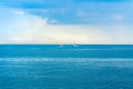 Two little boats go far away into the open sea, blue sky Royalty Free Stock Photo