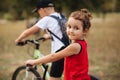 Two little boy and girl cyclists riding their bikes and enjoy having fun. Kid outdoors sport summer activity Royalty Free Stock Photo