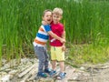 Two little boys friends hug each other in summer sunny day. Brother love. Concept friendship. Portrait of two boys, brothers and Royalty Free Stock Photo