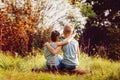 Two little boys friends hug each other in summer sunny day. Brother love. Concept friendship. Back view