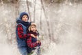 Two little boys friends hugging in winter forest. Brother love. Concept friendship