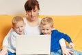 Two little boys and mother using laptop Royalty Free Stock Photo