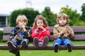 Two little boys and one girl eating chocolate Royalty Free Stock Photo