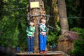 Two little boys playing together and having fun. Lifestyle family moment of siblings on playground. Kids friends play on rope park Royalty Free Stock Photo