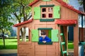 Two little boys playing together and having fun. Lifestyle family moment of siblings on playground. Kids friends play on tree Royalty Free Stock Photo