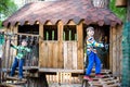 Two little boys playing together and having fun. Lifestyle family moment of siblings on playground. Kids friends play on tree Royalty Free Stock Photo