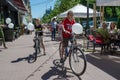 Two little boys riding bicycles with baloons during children protection day