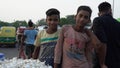 two little boys selling garlic