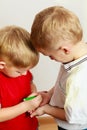 Two little boys siblings playing together