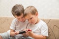 Two little boys with smartphone Royalty Free Stock Photo